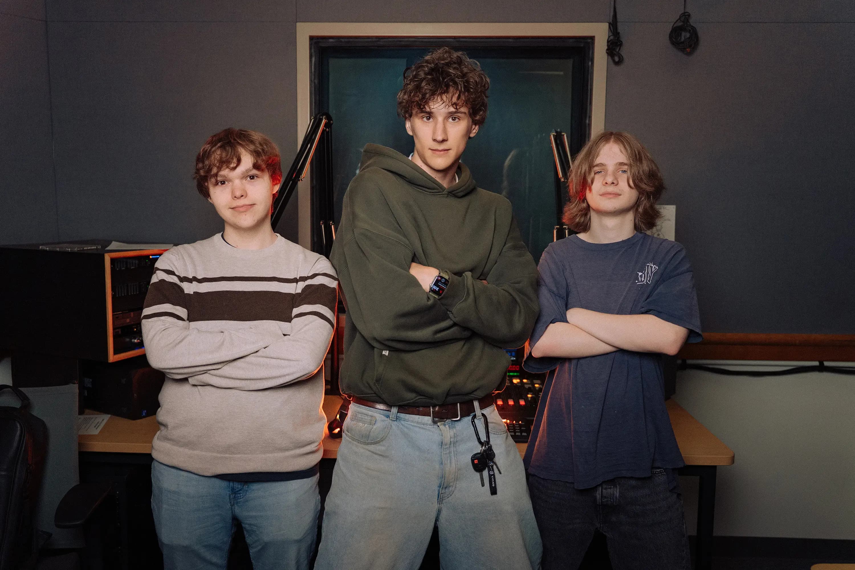 Nick, AJ, and Caden posing in the Basement Banter studio